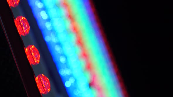 Neon Colored Lights on Carousel Ferris Wheel. Moon Night Bokeh in Amusement Park, Entertainment Zone alt