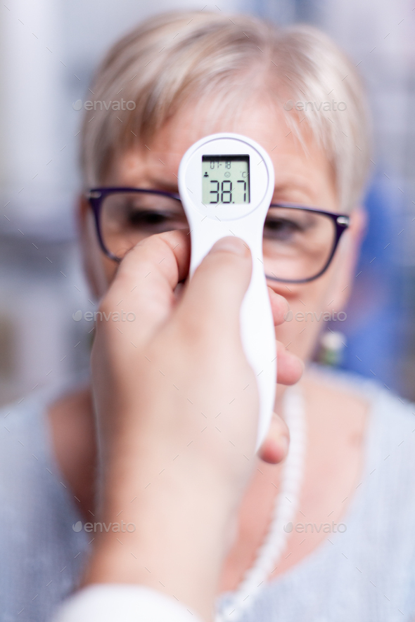 Thermometer showing body temperature - Stock Photo - Images