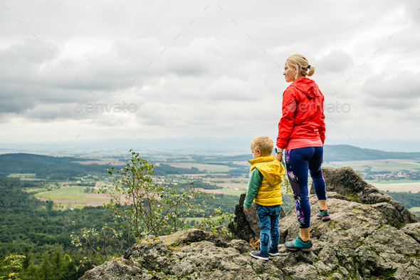 Mother with little boy travelling in mountains - Stock Photo - Images