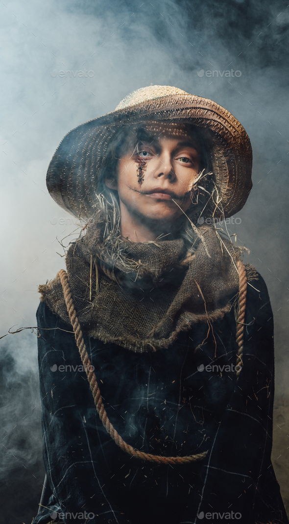 Ragged woman with make up posing with straw hat Stock Photo by fxquadro