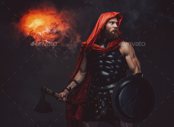 Bearded praetorian in black armor posing in smoky room