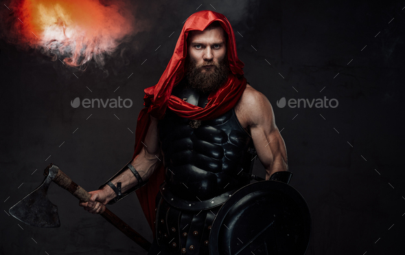 Bearded praetorian in black armor posing in smoky room