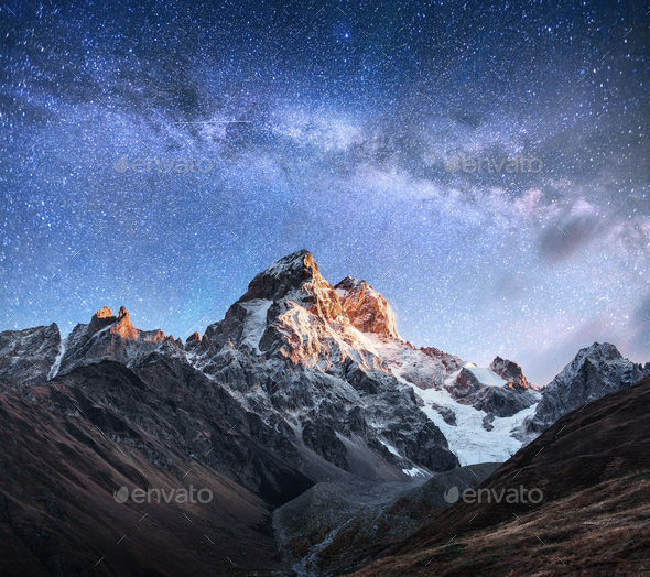 Fantastic starry sky. Autumn landscape and snow-capped peaks. Main Caucasian Ridge. Mountain View - Stock Photo - Images