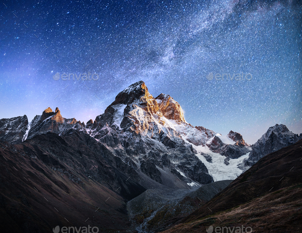Fantastic starry sky. Autumn landscape and snow-capped peaks. Main Caucasian Ridge. Mountain View - Stock Photo - Images