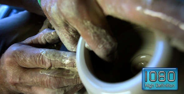 Artist Works With Clay At Potter's Wheel