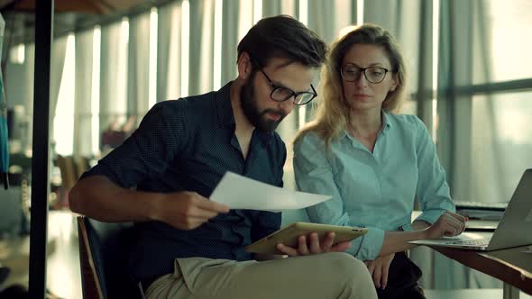 Media Marketing Discussion Meeting. Two Colleague Talking In Office About Business Project. alt