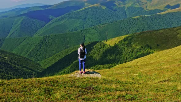Backpacker Posing on the Hill Nature Scene