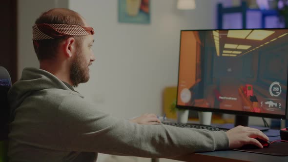 Pro Man Gamer Turning Head Looking at Camera Smiling alt