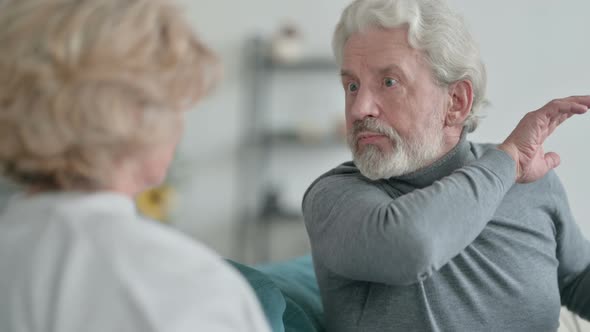 Close Up of Old Couple Fighting Arguing at Home alt