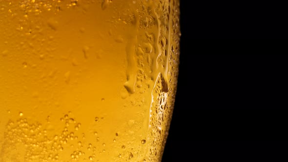Half a Beer Glass with Falling Water Drops