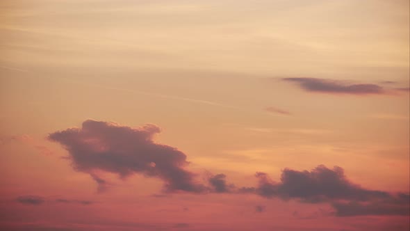 Orange Sky with Disappearing Clouds at Dusk