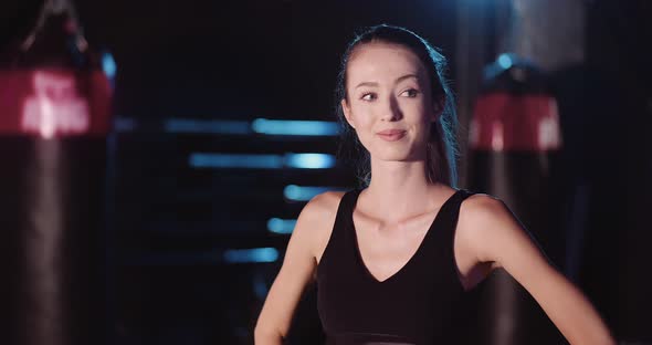 Attractive Female Athlete In Sportswear At Gym alt