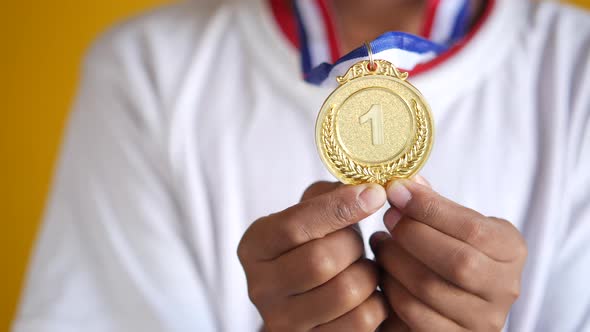 First Place Throphy Against Yellow Background alt