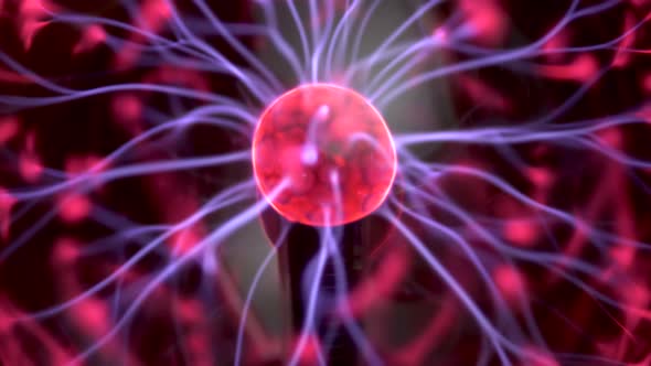 Plasma Ball Gives Out Small Lightning. Experiments with Electricity Closeup alt