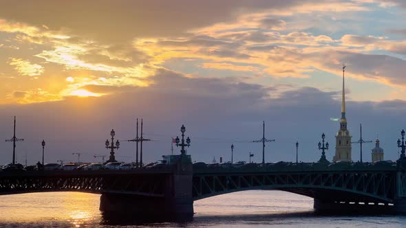 Panorama of Troitsky Bridge and Peter and Paul Fortress at Sunset Dramatic Orange Sky Storm Clouds alt