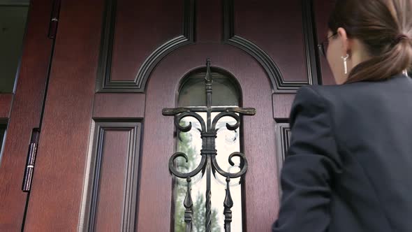 Woman and the state structure are persistently knocking on the door of house alt