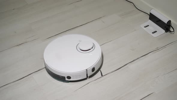Automatic Robot Vacuum Cleaner Cleaning the Room