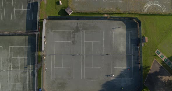 Top Down Aerial Pan of People Playing on Tennis Courts in Glen Head Long Island alt