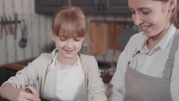 Little Girl Making Bread Dough alt