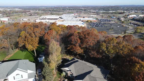 Aerial view of Eau Claire residential neighborhood with large shopping center seen.