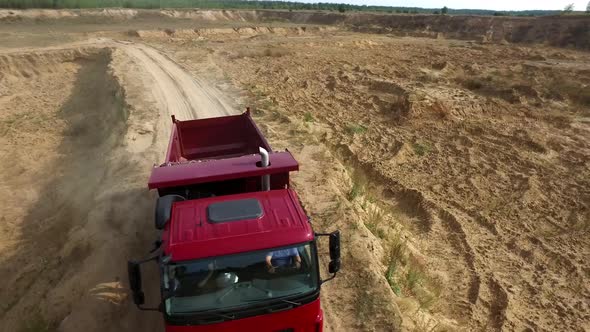 Dump Truck Driving On Countryside alt