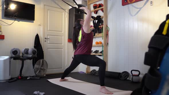 Different yoga poses performed in home gym with various gym equipment in background alt