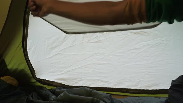 The Tourist Opens the Tent From the Inside alt