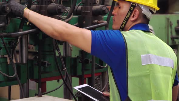 Smart Factory Worker Using Machine in Factory Workshop alt