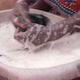 African woman washing laundry by hand - VideoHive Item for Sale