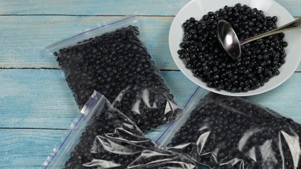 Packages with Blueberries in Zipper Plastic Bags for Freezing. Frozen, Preservation Berries Food alt