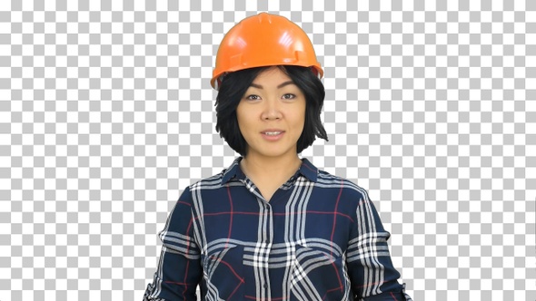 Female engineer standing and talking to a camera, Alpha Channel