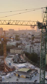 Construction Crane in the City at Sunrise alt