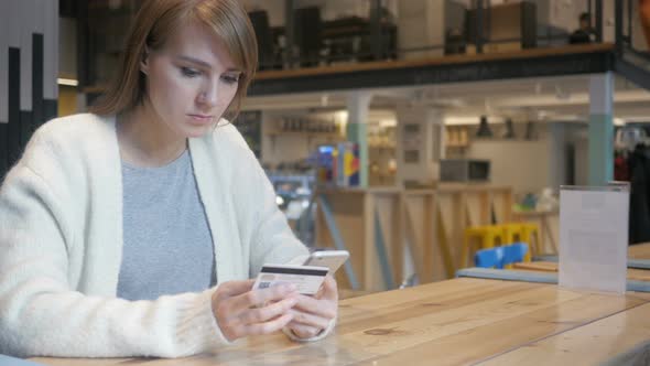Woman in Cafe Shopping Online on Smartphone, Payment alt