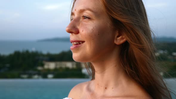 Happy Woman Looking at Sunset and Dream of Happy with Sea and Mountains alt