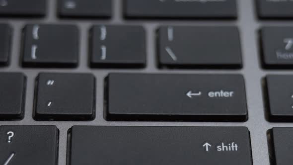 Enter Button Pressing a Lot of Times on Keyboard Laptop Keyboard Close Up alt