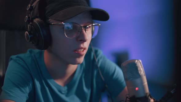 Caucasian Young Teen Guy Plays Games On Computer And Streams The Games Live alt