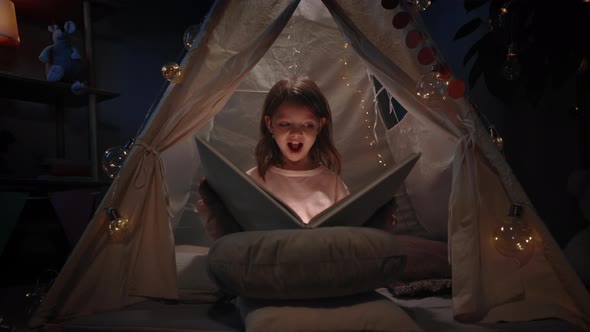 Pretty Little Kid in Cute Makeshift Hut Having Fun in Her Room in Evening alt