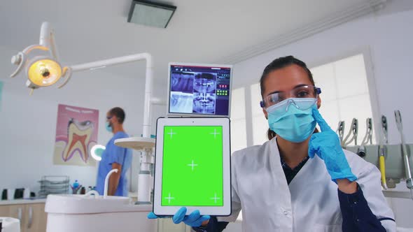 Pov Patient to Dentist Doctor Showing Tablet with Chroma Display alt