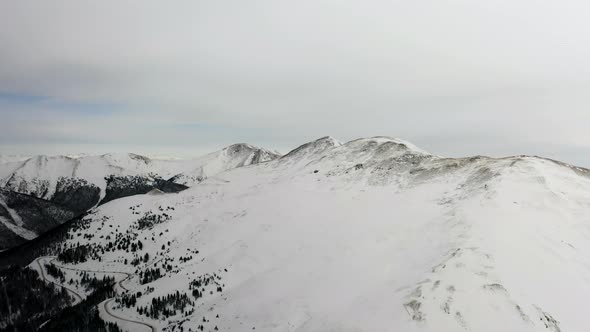  4k view above the Rocky Mountains and snow covered Arapaho and Roosevelt National Forests  alt