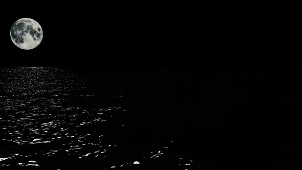 Moonlight path with low fool moon above the sea