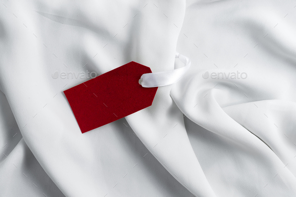 Simple Tag Mockup for presenting branding or logo concepts in fashion industry on white silk