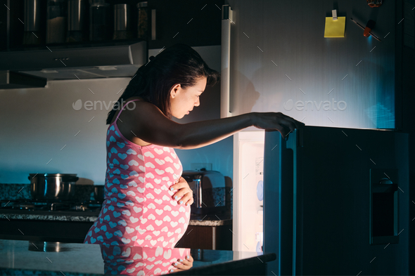 Pregnant woman eating at night