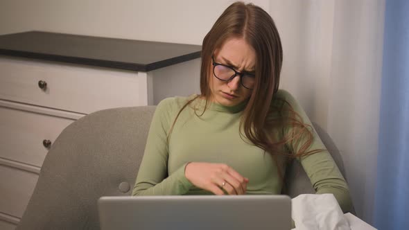 Focused Woman in Glasses Chatting on Laptop Browsing Surfing Internet Social Media Studying or alt
