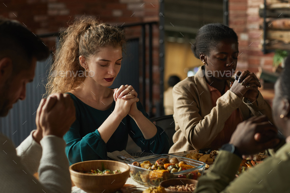 People Praying at Thanksgiving Dinner
