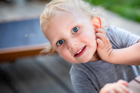 Portrait of cute little child boy with blond hair and blue grey eyes Stock  Photo by leszekglasner