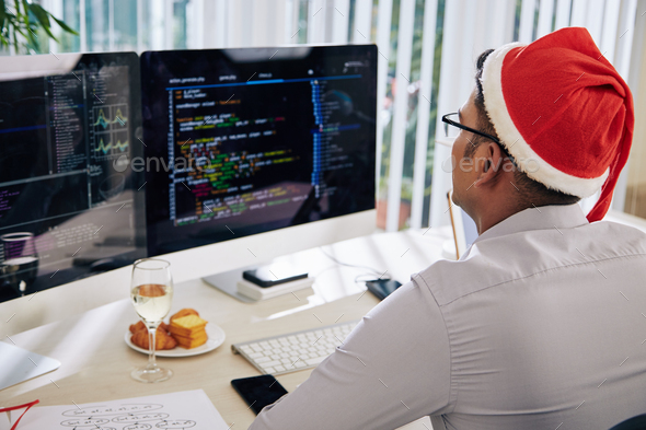 Working in office on Christmas eve Stock Photo by DragonImages  PhotoDune