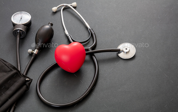 Medical stethoscope and sphygmomanometer on black background, closeup view.  Stock Photo by rawf8