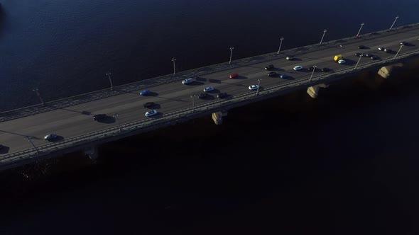 Car Motion on Highway Bridge Over River. Drone View Car Driving on River Bridge alt