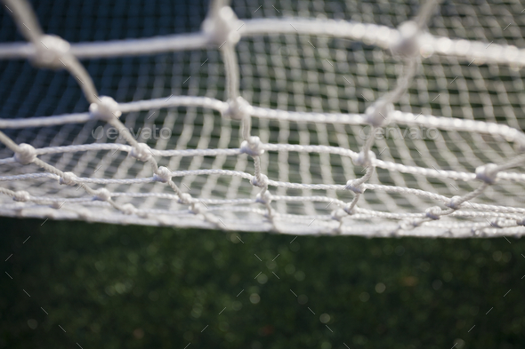 Close up of a white mesh, fishing net. Stock Photo by Mint_Images