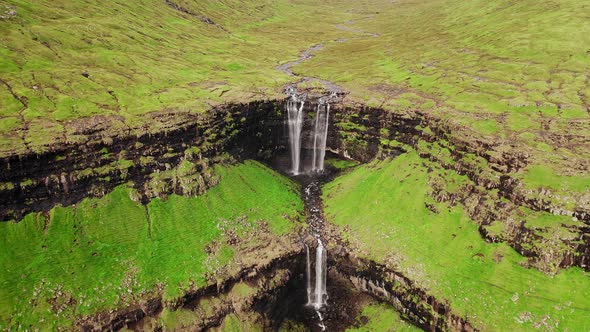 Aerial View of Stunning Waterfall in Faroe Islands. Aerial View of Fossa Waterfall. Cloudy Weather alt